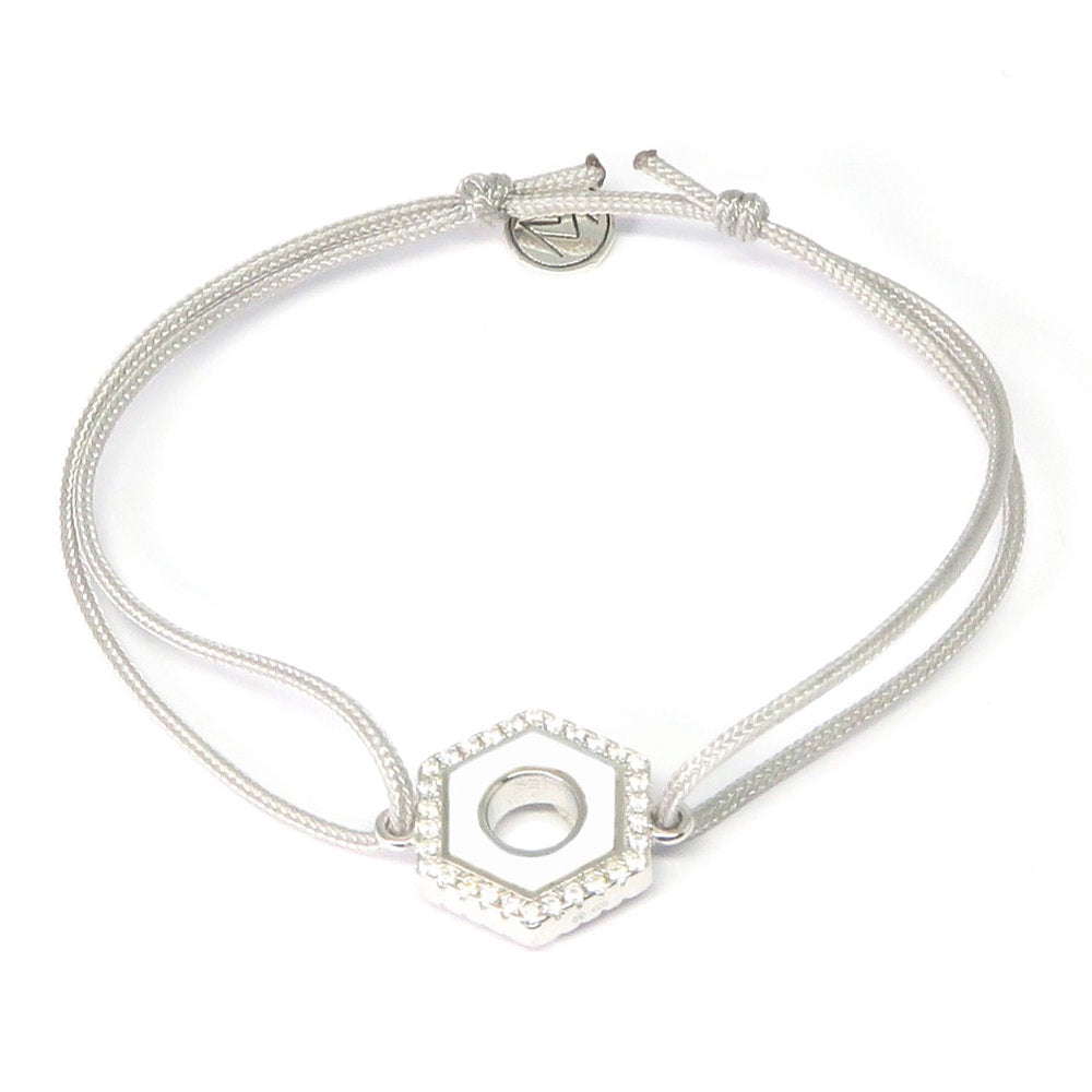 MORA bijoux, bracelet formé d'un écrou émaillé blanc reversible d'une couleur au choix et serti de diams, argent 925 monté sur un cordon blanc ajustable