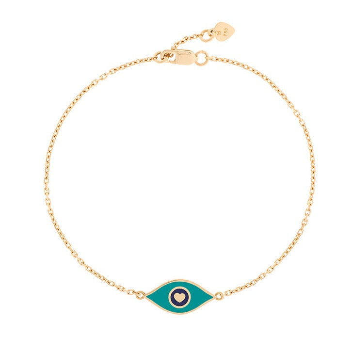 MORA bijoux, bracelet représentant un oeil émaillé bleu indigo en or jaune 18 carats monté sur une chaîne de 10mm d'épaisseur avec un petit coeur en or jaune 18 carats soudé sur le fermoir