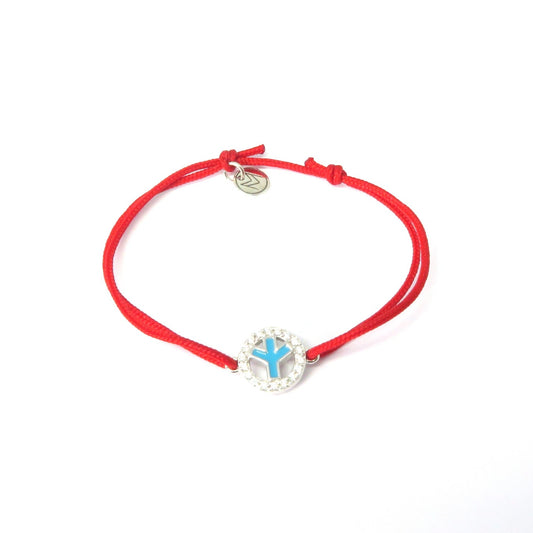MORA bijoux, bracelet au design peace and love émaillé turquoise réversible rouge en argent 925 serti de diams et monté sur un cordon rouge ajustable
